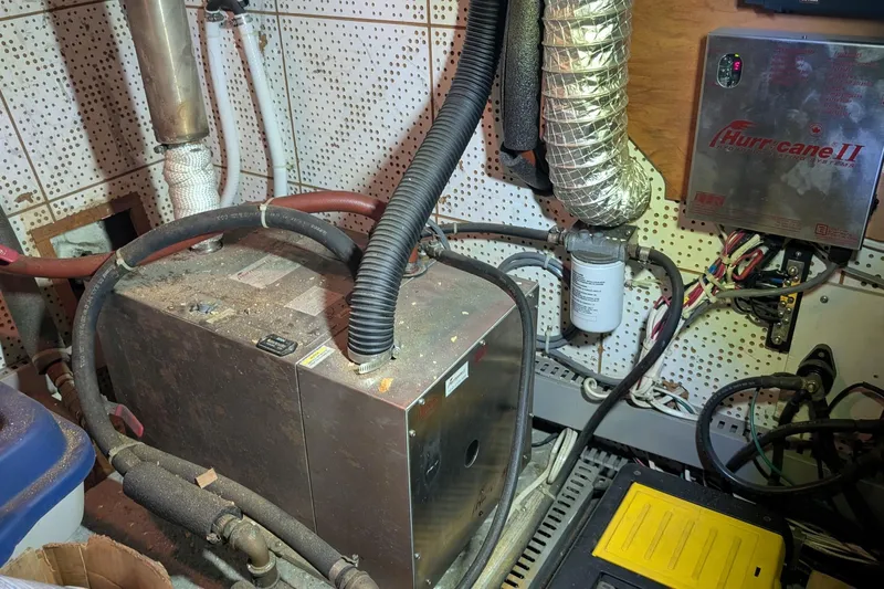 Moments Notice Yacht Photos Pics Engine room of a 1981 Sea Ranger 47 yacht with mechanical equipment and wiring.