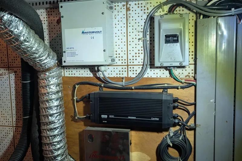 Moments Notice Yacht Photos Pics Electrical components and wiring inside a 1981 Sea Ranger 47 boat.