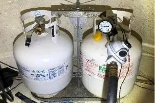 Moments Notice Yacht Photos Pics Two propane tanks with a pressure gauge on a 1981 Sea Ranger 47 boat.