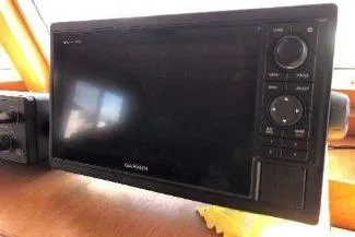 Moments Notice Yacht Photos Pics Garmin marine navigation system on 1981 Sea Ranger 47 yacht dashboard.