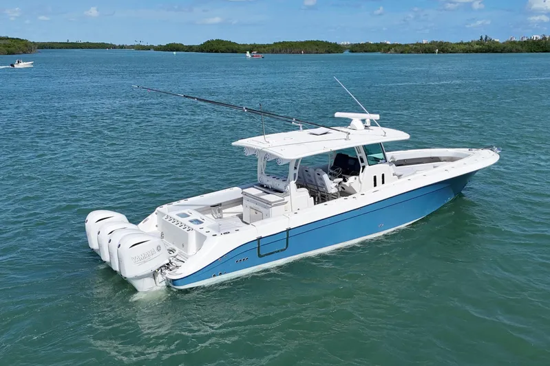  Yacht Photos Pics 2017 HCB 42 Siesta boat on blue water, featuring triple Yamaha engines.