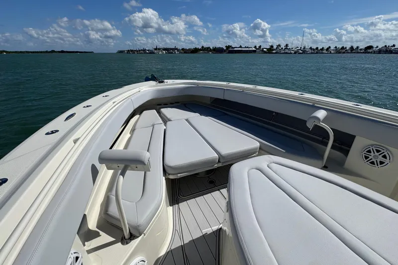  Yacht Photos Pics 2017 HCB 42 Siesta boat interior with cushioned seating, on a sunny day at sea.