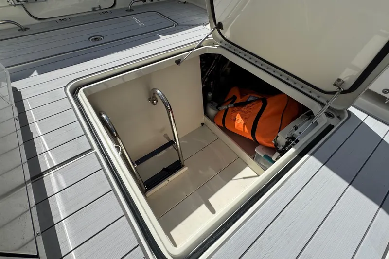  Yacht Photos Pics Open storage compartment on 2017 HCB 42 Siesta boat with orange bag and ladder.