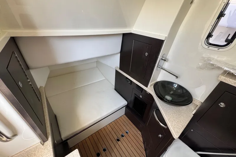  Yacht Photos Pics 2017 HCB 42 Siesta cabin interior with bed, sink, and wooden flooring.
