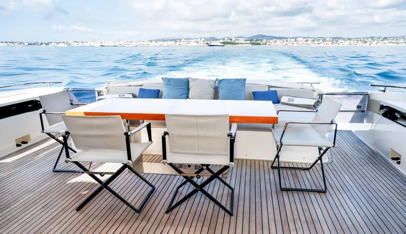  Yacht Photos Pics Luxury Ferretti Yachts 850 deck with seating, cruising on open water, 2020 model.
