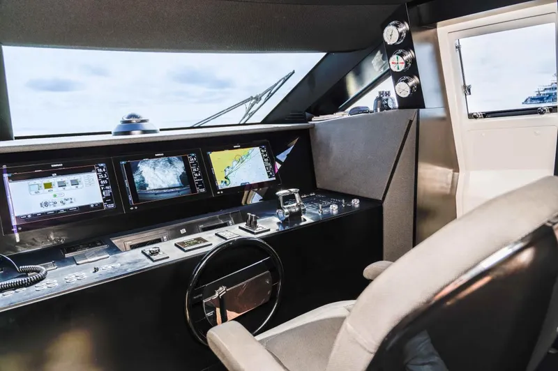  Yacht Photos Pics Cockpit of 2020 Ferretti Yachts 850 with advanced navigation displays and controls.