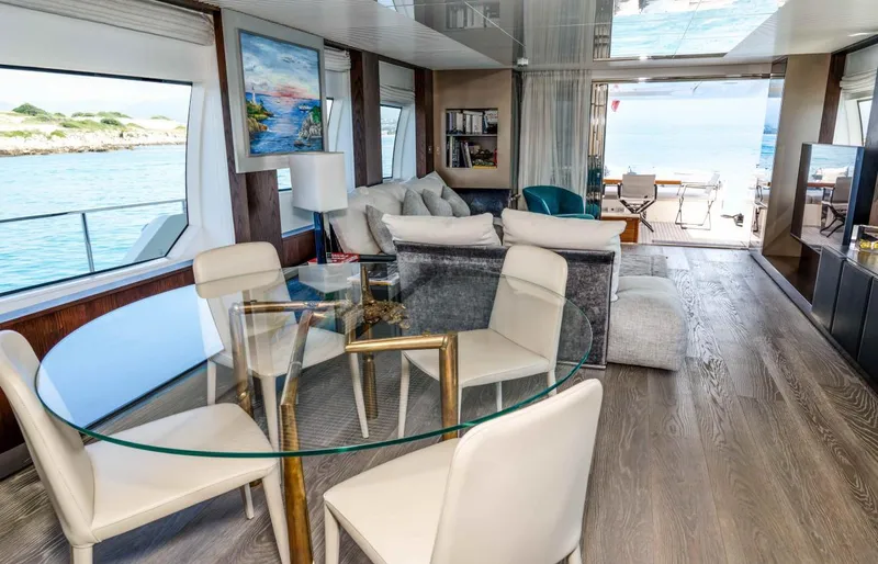  Yacht Photos Pics Luxurious interior of 2020 Ferretti Yachts 850 with elegant furnishings and ocean view.