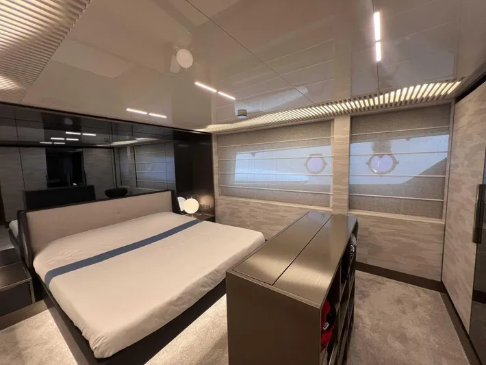  Yacht Photos Pics Luxurious bedroom interior of 2020 Ferretti Yachts 850 with modern design and elegant furnishings.