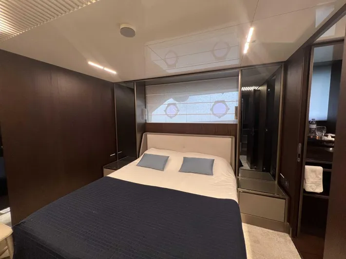  Yacht Photos Pics Luxurious bedroom interior of 2020 Ferretti Yachts 850 with modern design and elegant furnishings.