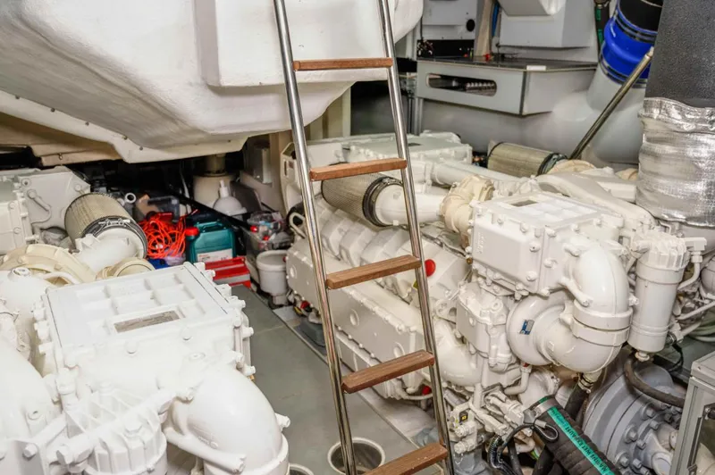  Yacht Photos Pics Engine room of 2020 Ferretti Yachts 850, featuring dual engines and a ladder.