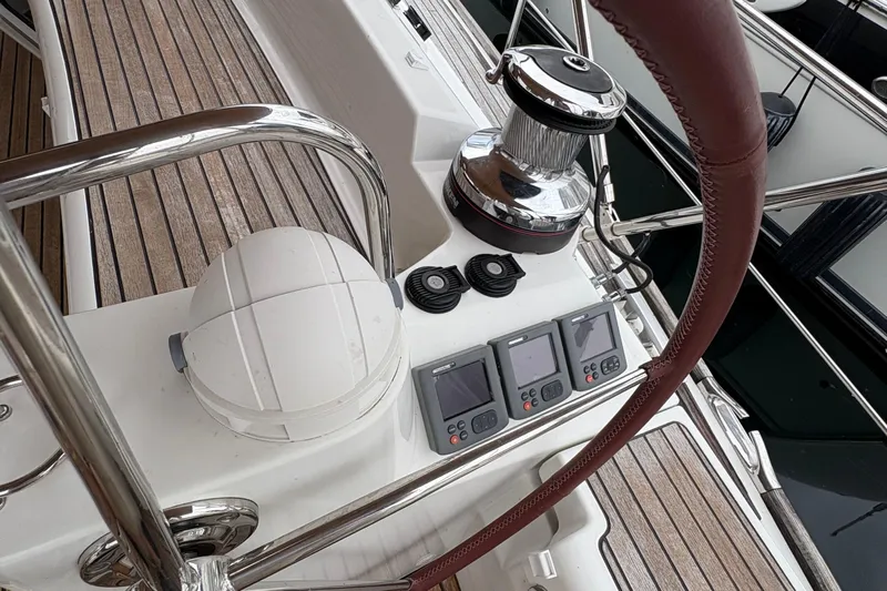 Star IV Yacht Photos Pics Cockpit of 2010 Jeanneau 50DS sailboat with navigation instruments and winch.