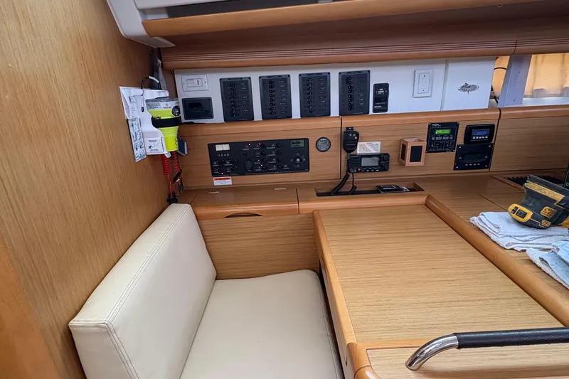 Star IV Yacht Photos Pics Nav station has storage under seat, in the table and under the arm rest to the left