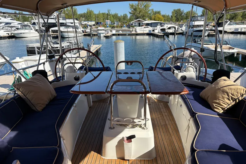 Star IV Yacht Photos Pics Looking Aft in Cockpit view of 2010 Jeanneau 50DS dual steering wheels.