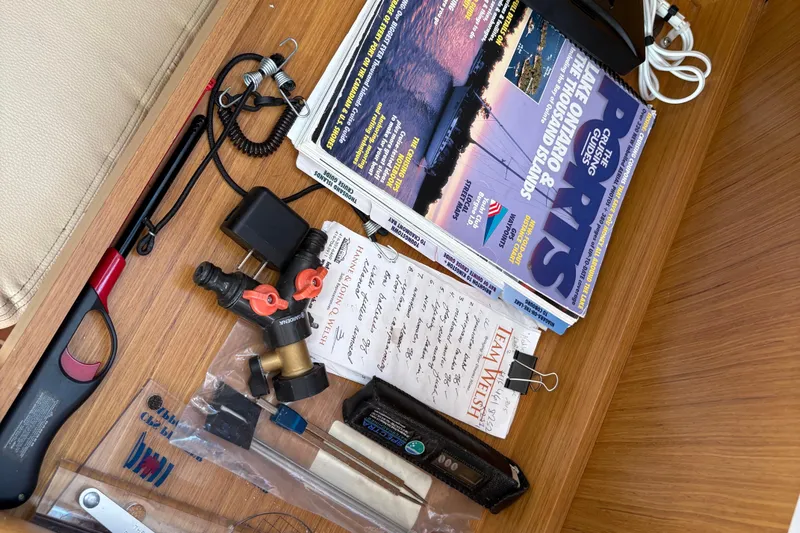 Star IV Yacht Photos Pics Drawer with boating magazines, tools, and notes on a Jeanneau 50DS, 2010 model.