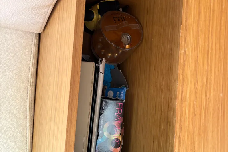 Star IV Yacht Photos Pics Arm rest storage at Nav station