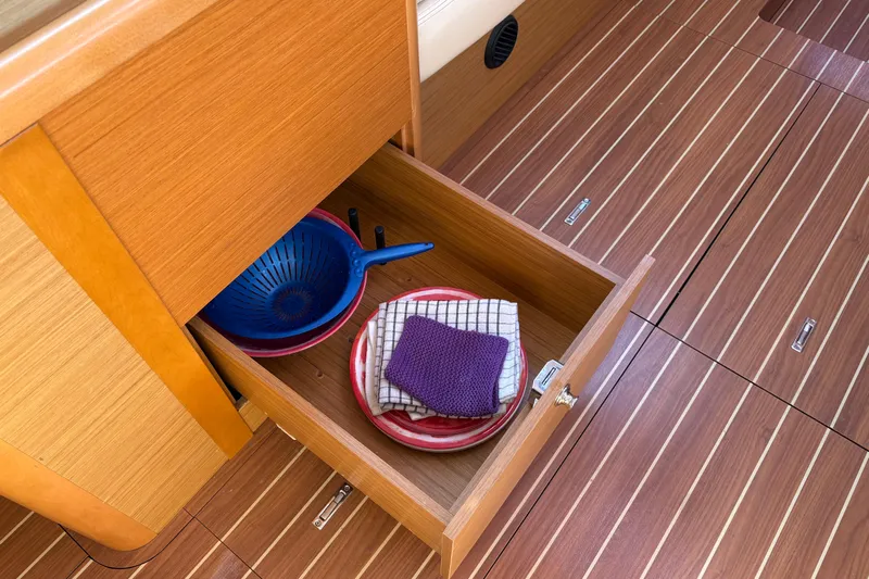 Star IV Yacht Photos Pics Storage Open drawer at Nav station