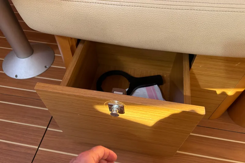 Star IV Yacht Photos Pics Storage in every nook and cranny - upder salon seating.