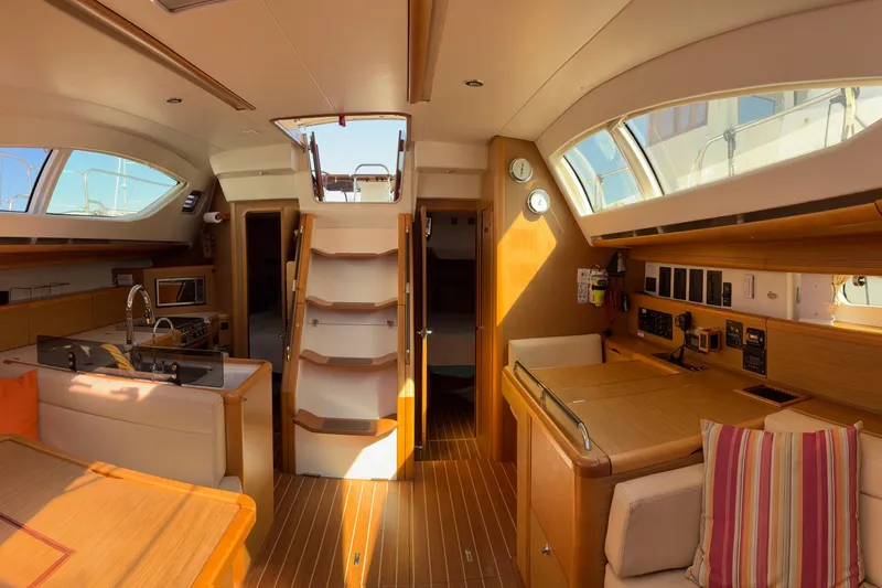 Star IV Yacht Photos Pics Interior of 2010 Jeanneau 50DS sailboat with modern wood finish and ample natural light.