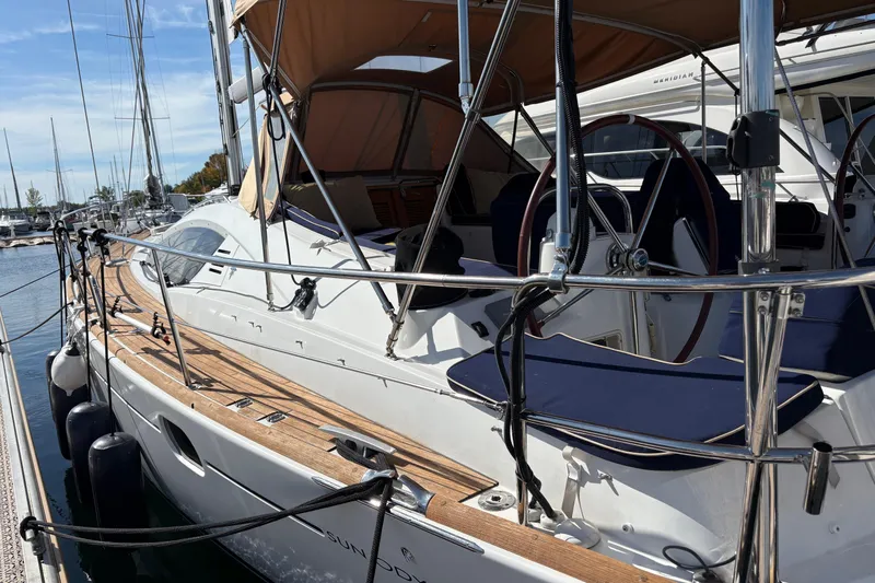 Star IV Yacht Photos Pics 2010 Jeanneau 50DS sailboat docked, featuring sleek design and wooden deck.