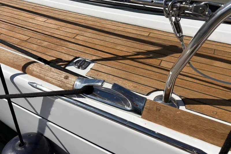 Star IV Yacht Photos Pics Deck of 2010 Jeanneau 50DS sailboat with wood finish and metal fittings.