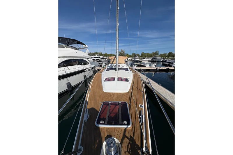 Star IV Yacht Photos Pics 2010 Jeanneau 50DS sailboat docked at marina, showcasing sleek deck design.