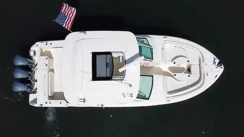 Lola Yacht Photos Pics Aerial view of 2017 Grady-White Freedom 375 boat with American flag.
