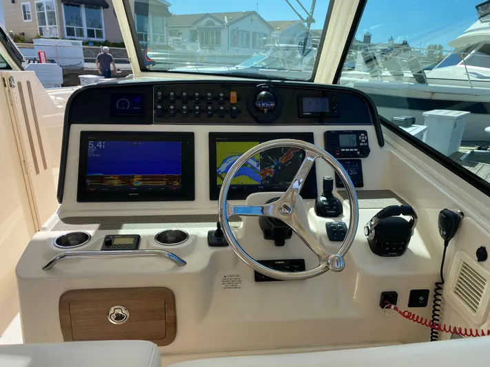 Lola Yacht Photos Pics 2017 Grady-White Freedom 375 helm with advanced navigation and control systems.