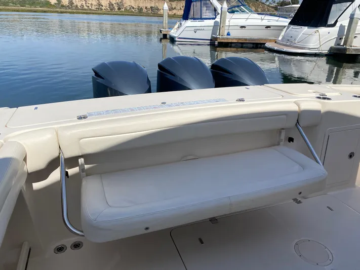 Lola Yacht Photos Pics 2017 Grady-White Freedom 375 boat with triple engines and foldable seating at the dock.