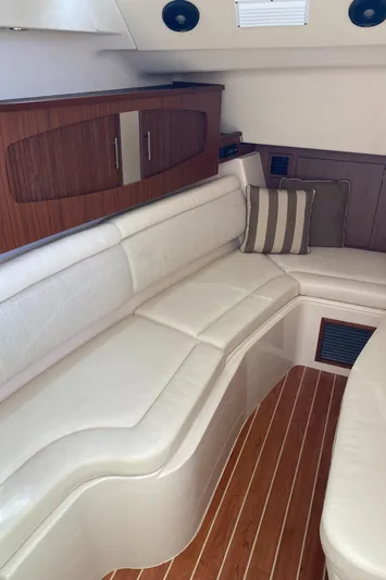 Lola Yacht Photos Pics 2017 Grady-White Freedom 375 interior with white leather seating and wood accents.