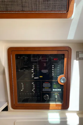 Lola Yacht Photos Pics Control panel of a 2017 Grady-White Freedom 375 boat, featuring switches and gauges.