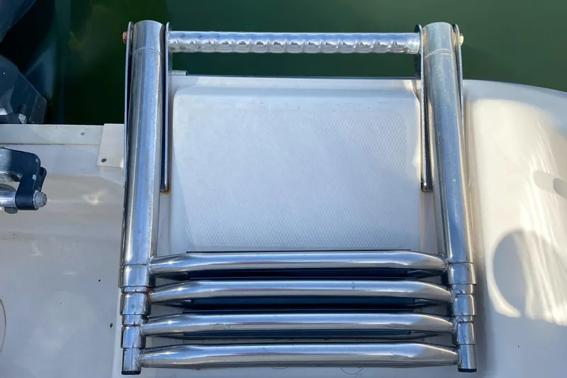 Lola Yacht Photos Pics Stainless steel boat ladder on 2017 Grady-White Freedom 375, folded on deck.
