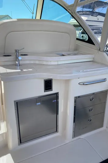 Lola Yacht Photos Pics 2017 Grady-White Freedom 375 boat interior with kitchenette and storage.