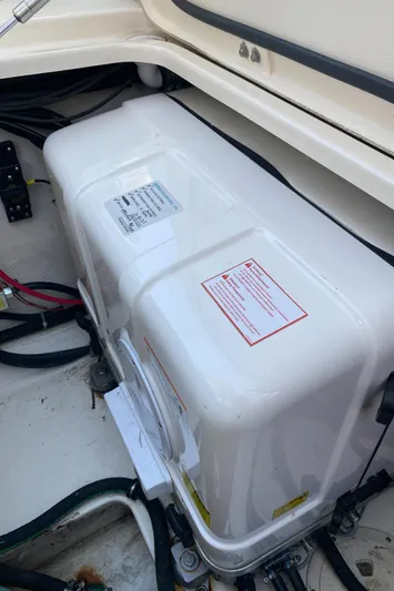 Lola Yacht Photos Pics 2017 Grady-White Freedom 375 boat compartment with electrical components and wiring.