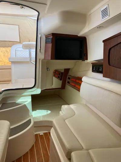 Lola Yacht Photos Pics Interior of 2017 Grady-White Freedom 375 boat, featuring seating and wooden accents.
