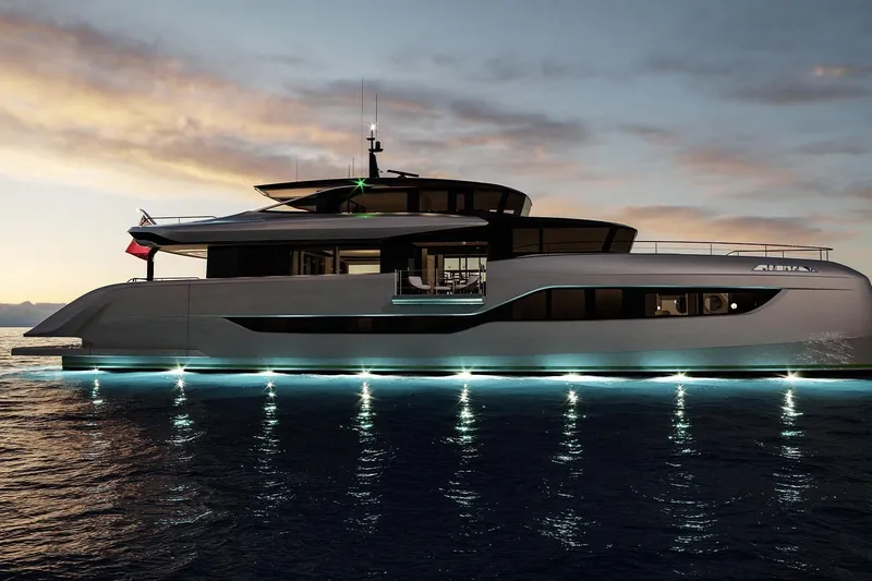  Yacht Photos Pics Luxurious 2026 Sunreef Ultima 111 yacht illuminated at sunset on calm waters.