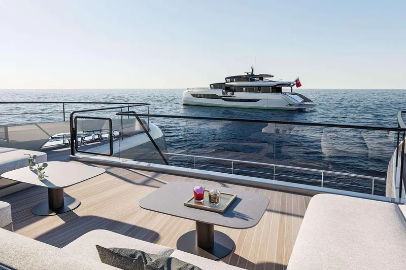  Yacht Photos Pics Luxurious Sunreef Ultima 111 yacht on serene ocean, 2026 model, with elegant deck seating.