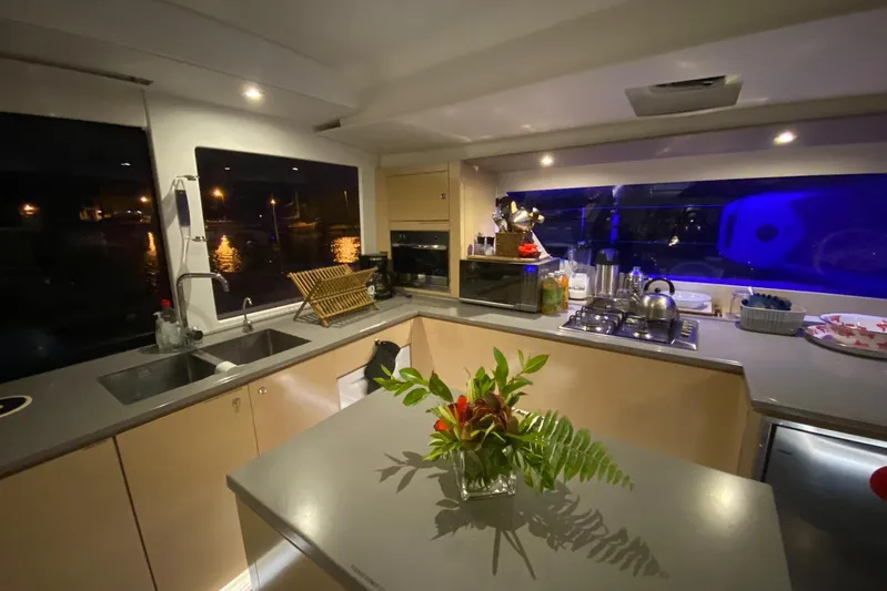 Nowhere Yacht Photos Pics Luxurious kitchen interior of 2016 Fountaine Pajot SABA 50 yacht, featuring modern appliances and elegant decor.