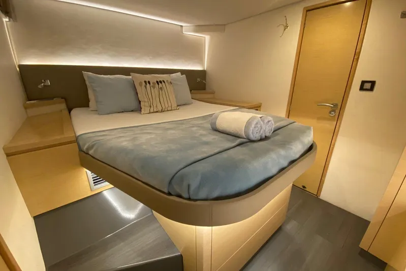 Nowhere Yacht Photos Pics Luxurious cabin interior of 2016 Fountaine Pajot SABA 50 catamaran, featuring a cozy bed.