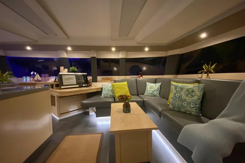 Nowhere Yacht Photos Pics Luxurious interior of 2016 Fountaine Pajot SABA 50 yacht with modern seating and decor.