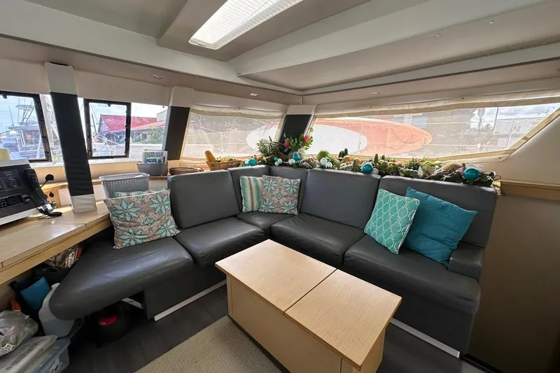 Nowhere Yacht Photos Pics Luxurious interior of 2016 Fountaine Pajot SABA 50 catamaran with cozy seating and decor.