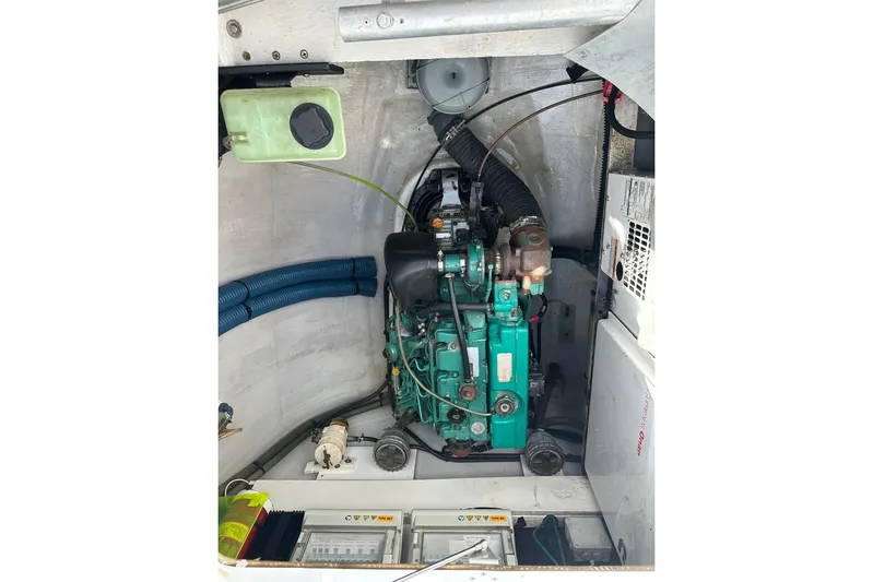 Nowhere Yacht Photos Pics Engine compartment of 2016 Fountaine Pajot SABA 50 catamaran, showcasing mechanical components.