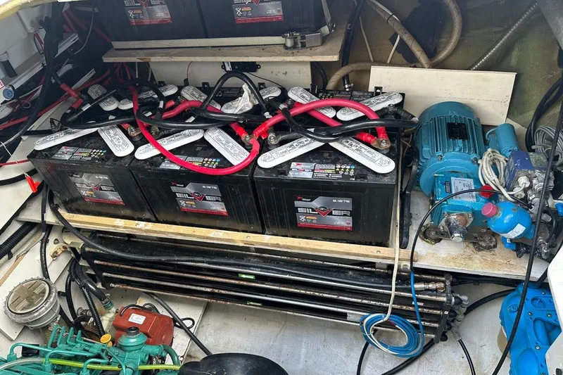 Nowhere Yacht Photos Pics Battery compartment of 2016 Fountaine Pajot SABA 50 yacht, featuring multiple batteries and equipment.