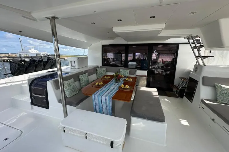 Nowhere Yacht Photos Pics Spacious 2016 Fountaine Pajot SABA 50 yacht interior with elegant dining area and modern design.
