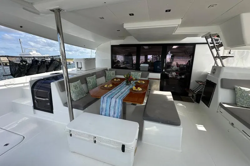 Nowhere Yacht Photos Pics Spacious 2016 Fountaine Pajot SABA 50 yacht interior with elegant dining area and modern decor.