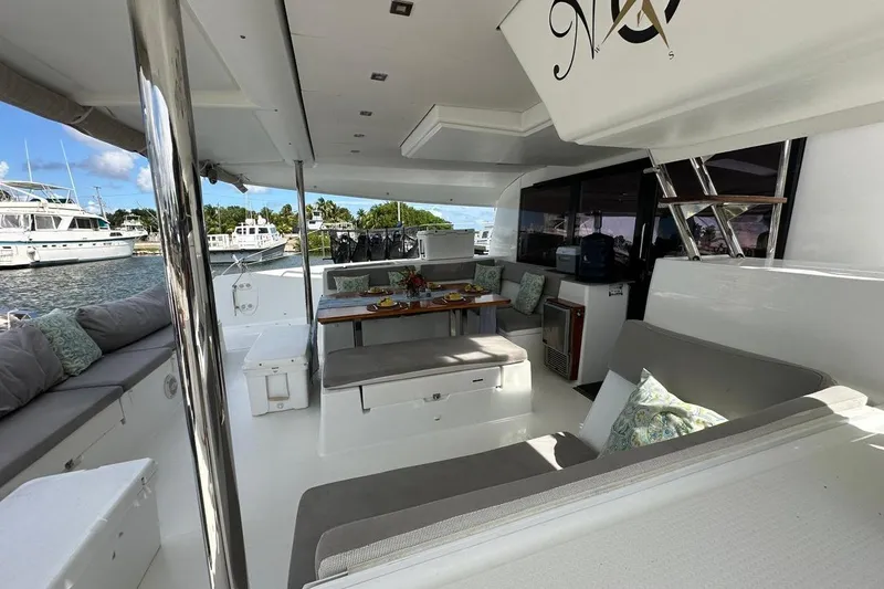 Nowhere Yacht Photos Pics Luxurious 2016 Fountaine Pajot SABA 50 yacht interior with elegant seating and dining area.