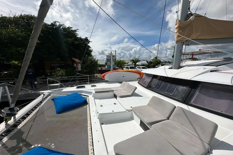 Nowhere Yacht Photos Pics 2016 Fountaine Pajot SABA 50 catamaran with spacious deck and comfortable seating.