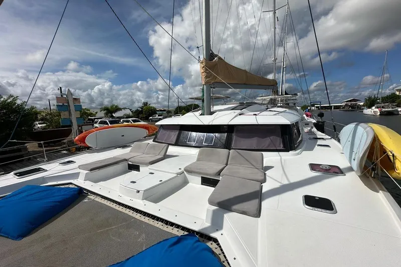 Nowhere Yacht Photos Pics 2016 Fountaine Pajot SABA 50 catamaran docked, featuring spacious deck and seating.