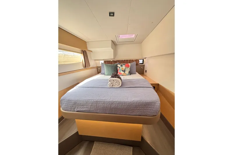 Nowhere Yacht Photos Pics Luxurious cabin interior of 2016 Fountaine Pajot SABA 50 yacht with cozy bedding.