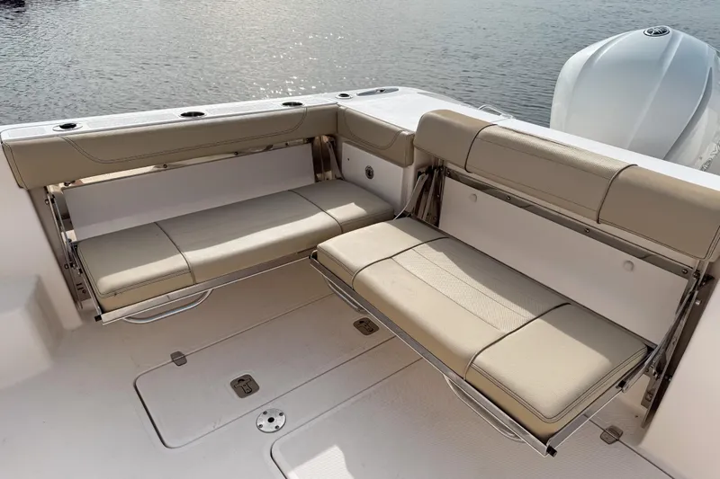  Yacht Photos Pics 2016 Pursuit OS 355 Offshore boat with beige foldable seating on deck.