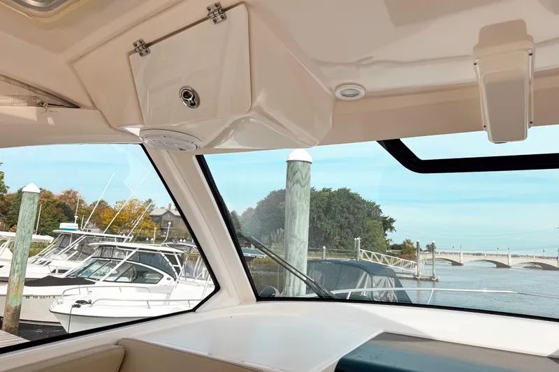  Yacht Photos Pics Interior view from a 2016 Pursuit OS 355 Offshore boat docked at a marina.